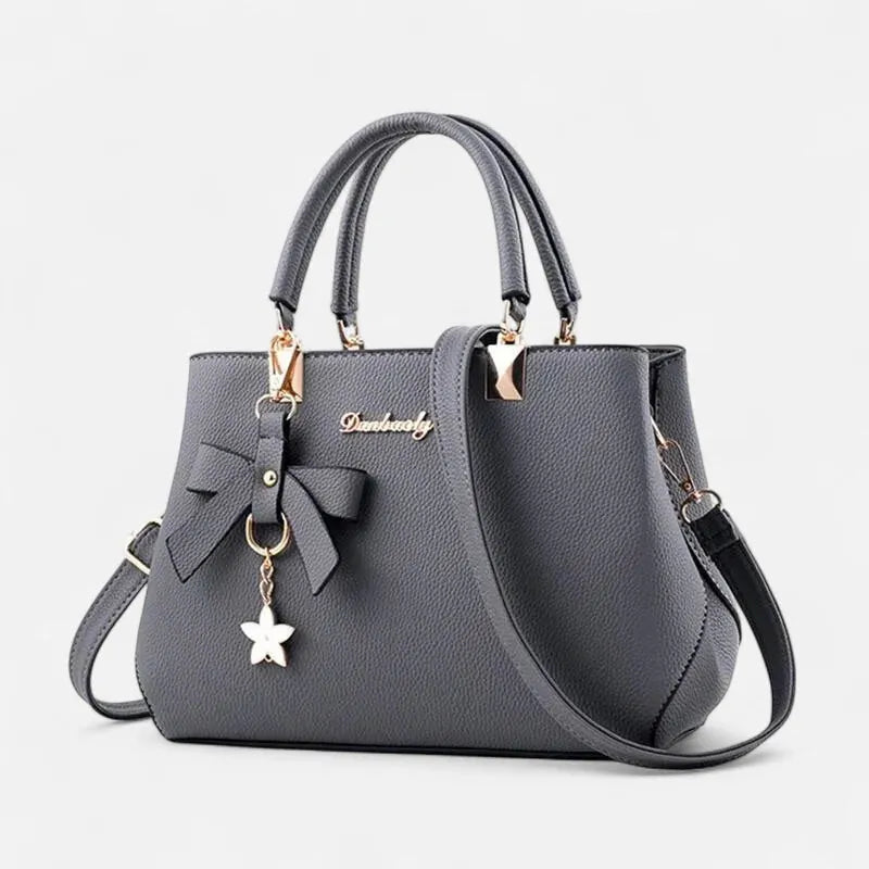 Petit sac à main bandoulière avec son charms noeud et fleur Léana