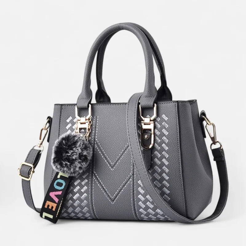 Sac à main bandoulière avec son charms pompon Aurore