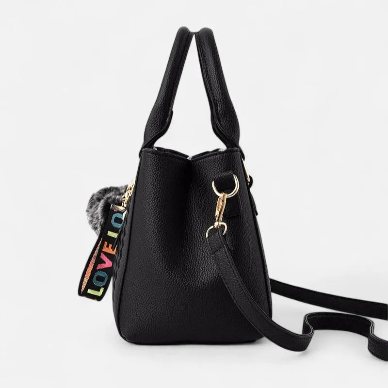 Sac à main bandoulière avec son charms pompon Aurore