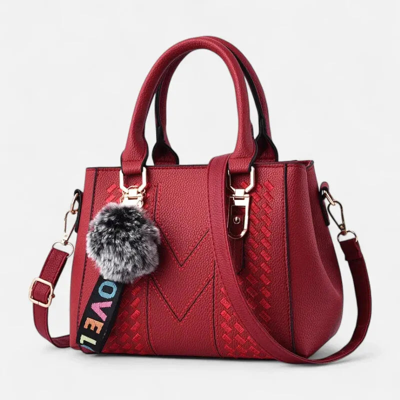 Sac à main bandoulière avec son charms pompon Aurore