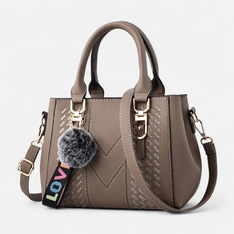 Sac à main bandoulière avec son charms pompon Aurore