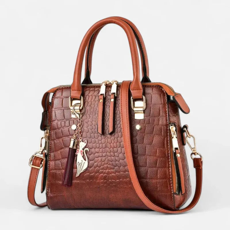Sac à main bandoulière imitation croco avec son charms chat doré Camélia