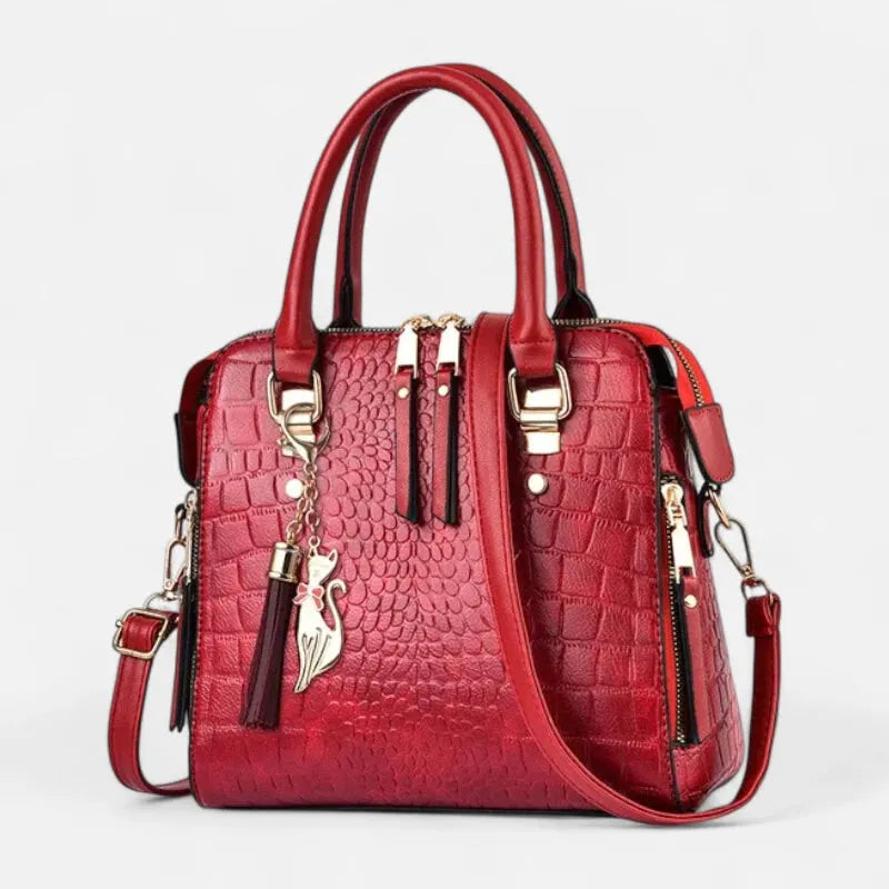 Sac à main bandoulière imitation croco avec son charms chat doré Camélia