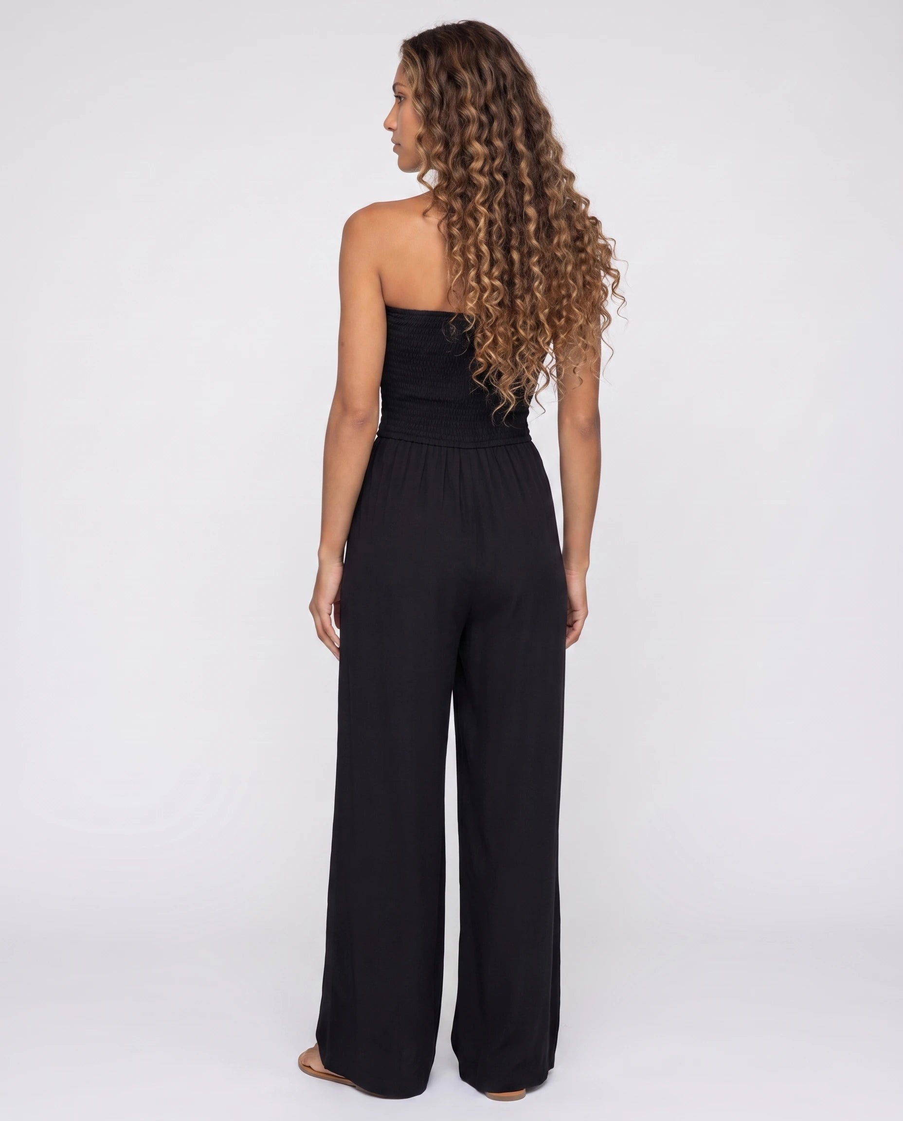 Combinaison bustier noire à jambe large — Lucile - vue studio, dos