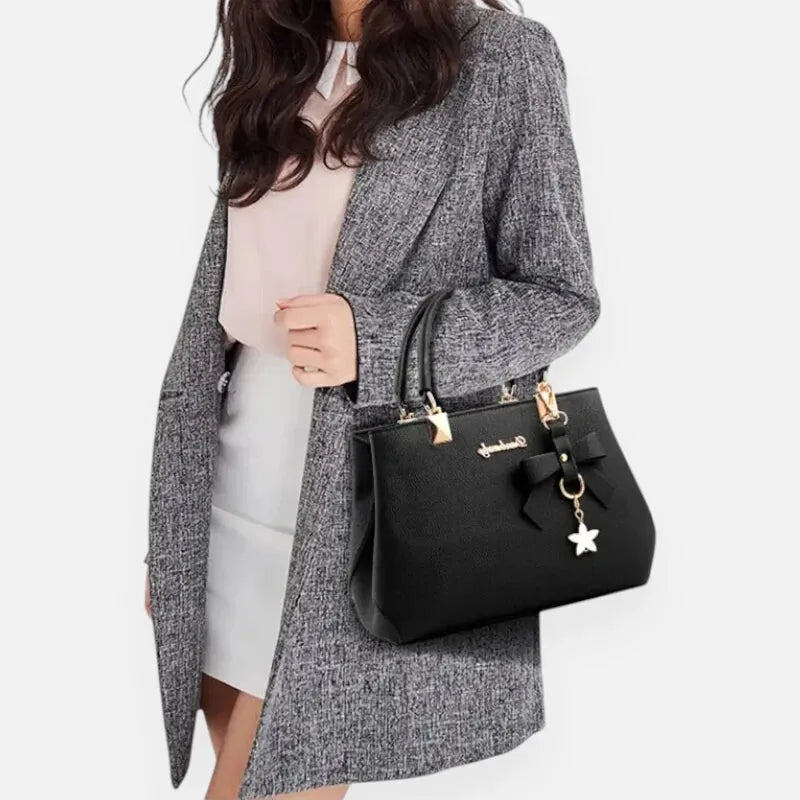 Petit sac à main bandoulière avec son charms noeud et fleur Léana