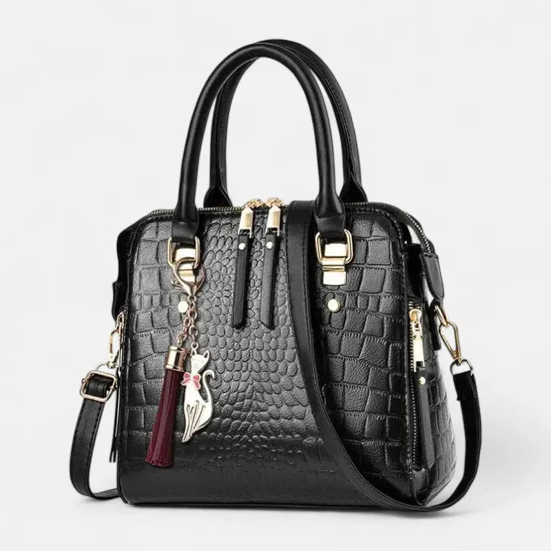 Sac à main bandoulière imitation croco avec son charms chat doré Camélia